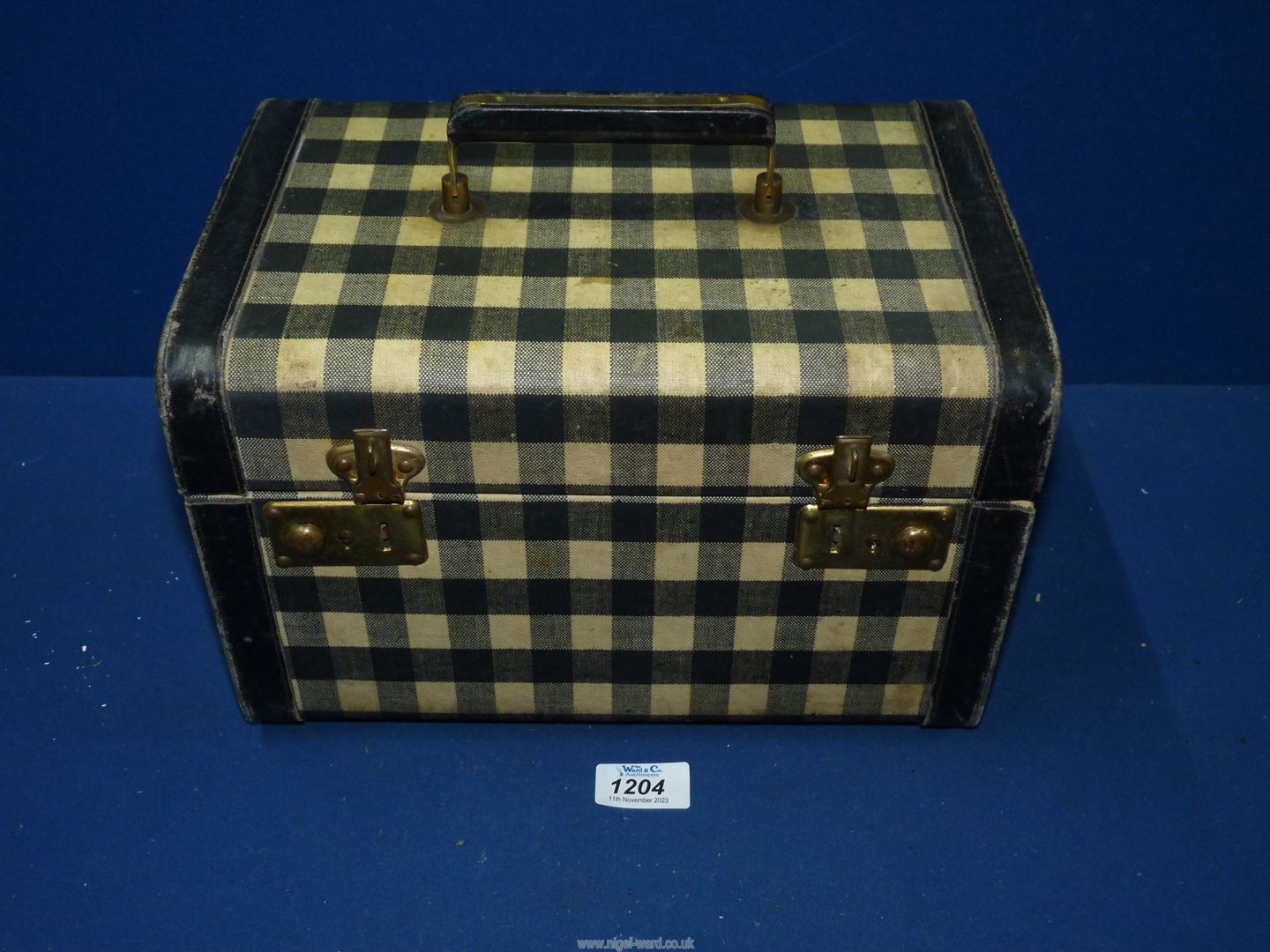 A vintage vanity Case in black and white gingham, 12'' wide x 10 1/2" high x 8'' deep.