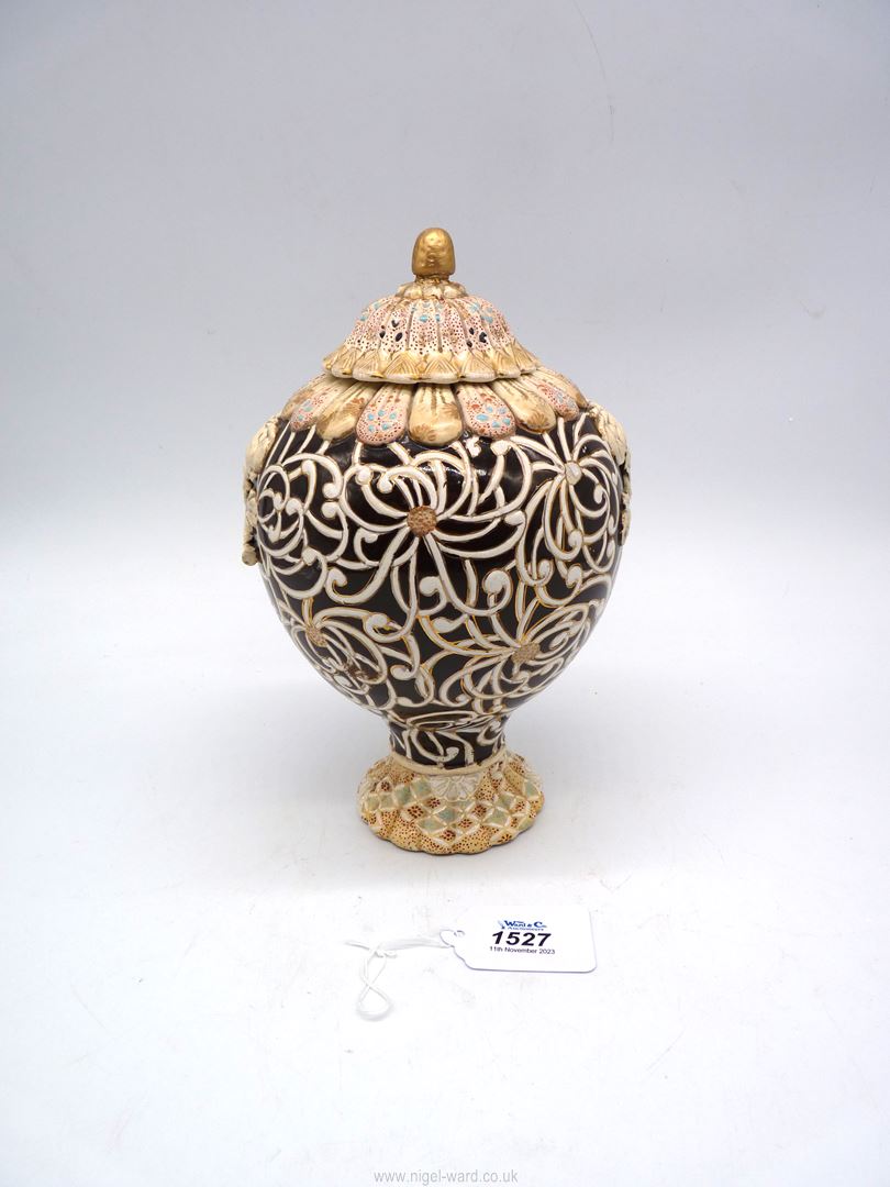 A large Japanese Satsuma jar and lid with foliate designs in relief, Meiji period, circa 1900,