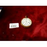 An AWW Co. Waltham USA 'Traveler' brass pocket watch, glass a/f.