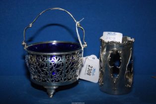 A silver pierced basket dish with blue glass liner, Birmingham 1931,