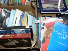 Two boxes of books comprising a mix of music/art/royalty, plus music dictionaries,