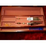 A wooden jewellery box with fitted interior together with a small quantity of jewellery including a