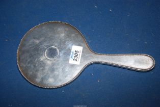 A Silver backed hand Mirror, hallmarks rubbed.