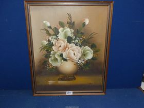 A framed Oil on board depicting a still life of flowers, signed lower right Sally Silvia, 18" x 22".