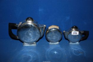 A three piece white metal Art Deco style tea set, teapot, jug, sugar, very heavy.