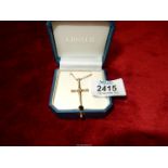 A 9 ct. gold Cross and chain, 5 gms.