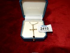 A 9 ct. gold Cross and chain, 5 gms.