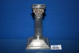 A silver Corinthian column candlestick with weighted base, Sheffield 1928, makers Walker & Hall.