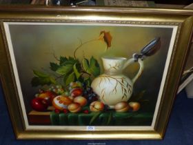 A framed Oil on canvas of Still life with fruit and a jug, indistinctly signed lower right,
