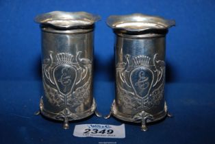 A pair of Silver vases with fluted rims,