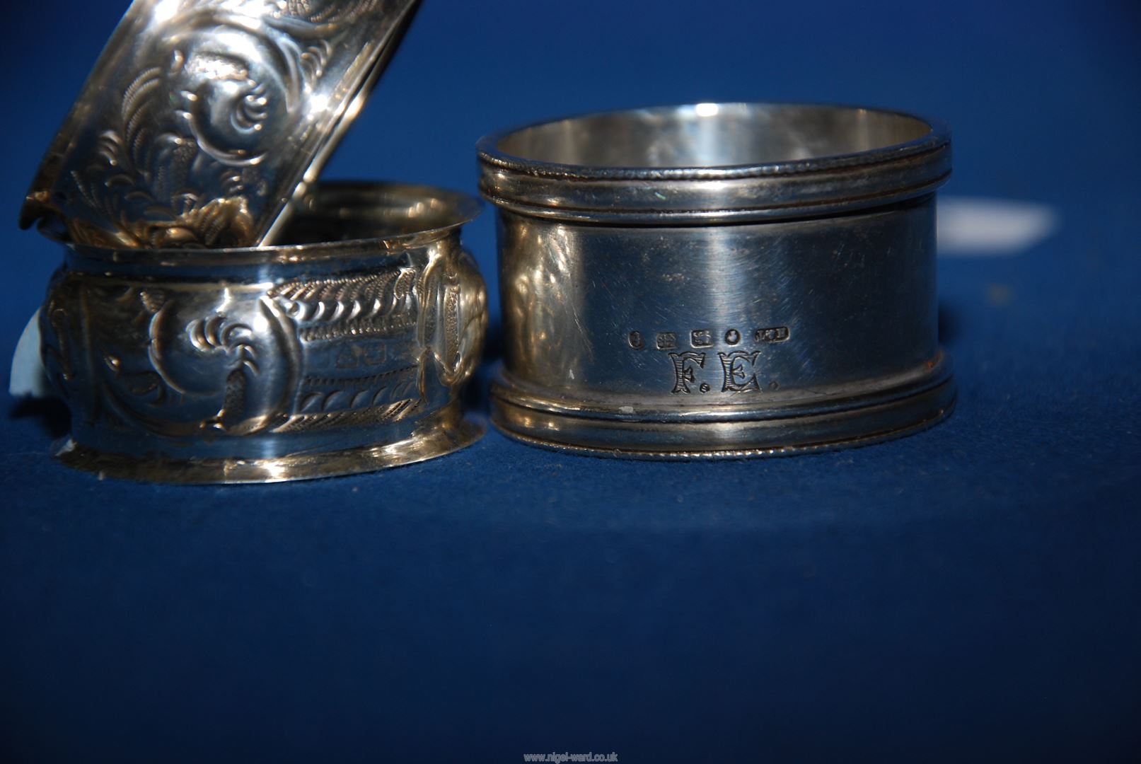 A pair of silver napkin rings, Chester (hallmarks rubbed) and a silver napkin ring, Birmingham 1880, - Image 2 of 2