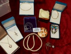 A box of costume jewellery including some silver.