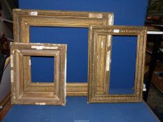 Three picture frames of various sizes.