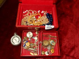 A red Moroccan leather jewellery box, 7" x 5", including contents, necklaces, etc.
