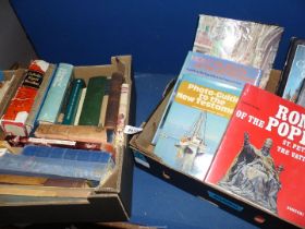 Two boxes of religious themed books including antique bibles, rare religious study guides, etc.