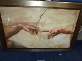 A framed Michelangelo print 'Creation of Adam', Sistine Chapel, 28" x 41".