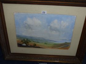 A heavy framed and mounted Watercolour depicting a coastal seascape with countryside and sheep