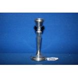 A Silver candlestick with weighted base, Birmingham 1978, makers Pinder brothers, 5 1/2'' tall.