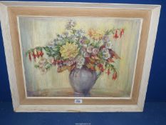 A framed Oil on board depicting a still life of flowers in a jug, signed lower left Dorothy G.