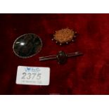 A silver mounted oval Victorian brooch,