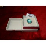 An unmarked silver dress ring set with large Aquamarine stone.