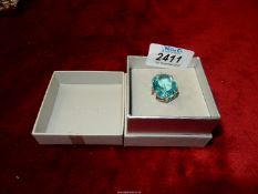 An unmarked silver dress ring set with large Aquamarine stone.