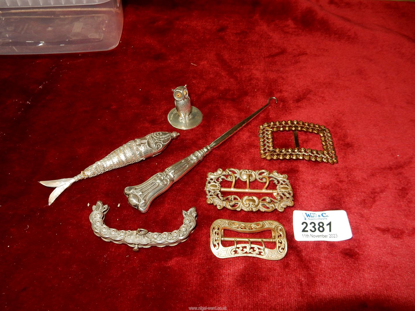A small quantity of jewellery including buckles, articulated fish,
