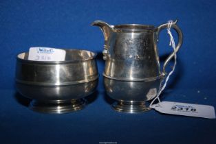 A Silver sugar bowl and cream jug, London 1929, makers William Comyns & Sons, jug weight 117.