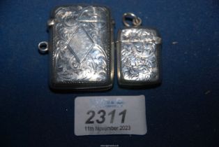 A silver vesta case, Chester 1909, makers Clark & Sewell and a miniature vesta case,