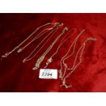 A quantity of silver and white metal chains, some clasps a/f., overall weight 23.55g.
