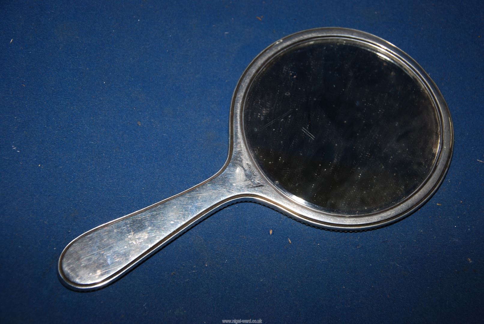 A Silver backed hand Mirror, hallmarks rubbed. - Image 2 of 3