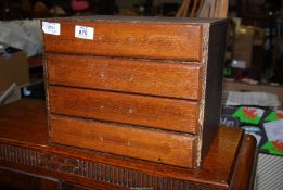 A small stationery cabinet with drawers.