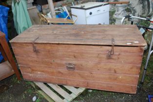 A large pine lidded box, 59'' wide x 24'' deep x 25'' high.