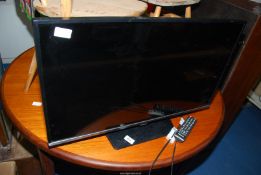 A Samsung 31'' flat screen TV with remote.