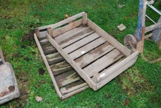 Two wooden vegetable crates.
