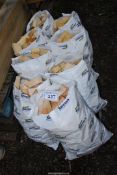 Eight small bags of softwood offcuts.