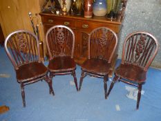 Four stick back kitchen chairs.
