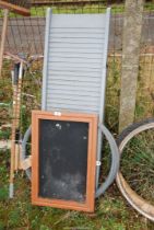 A plastic ramp, galvanised plain wire and a notice board.