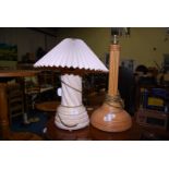 A woven bamboo/cane effect lamp base, and a table lamp with shade.