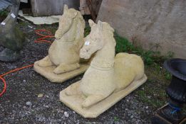 Two concrete horse ornaments, 24'' high x 35 1/2'' x 13 1/2'' bases.