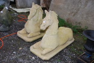 Two concrete horse ornaments, 24'' high x 35 1/2'' x 13 1/2'' bases.