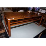 A coffee table with lower rack shelf unit, 41 1/2'' wide x 16'' deep x 16'' high.