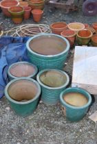 Five green glazed planters.