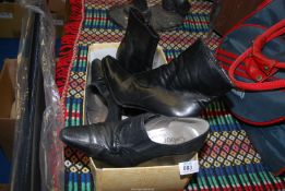 A pair of black leather Gabor high heeled shoes,