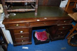 An office desk with leather top and key, 57'' wide x 29'' deep x 30 1/2'' high.