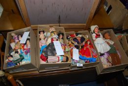 A quantity of costume dolls.