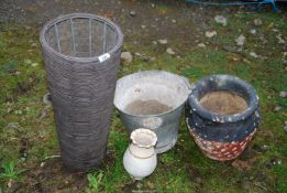 A galvanised bucket and three planters.