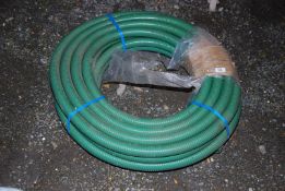 A quantity of plastic 1 1/2'' suction hose.