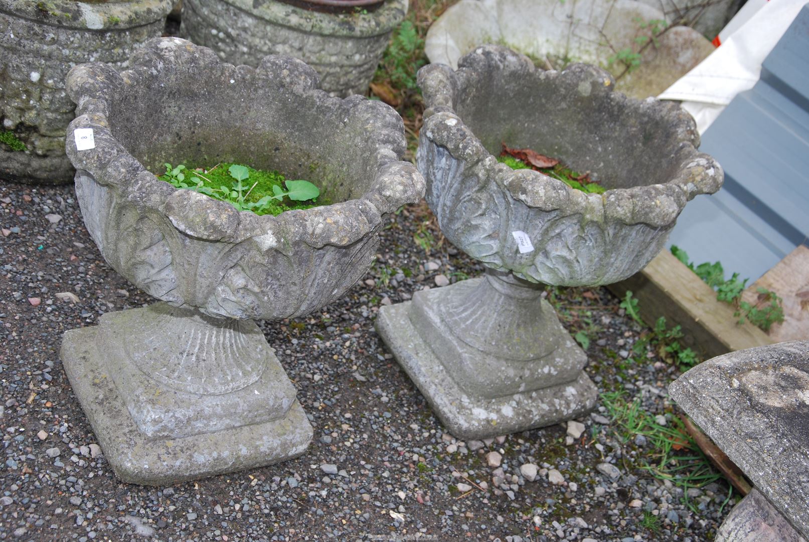 Two concrete planters, 20'' wide x 19'' high.