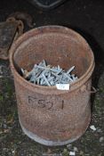 A box of 4'' galvanised roofing nails with some space washers.